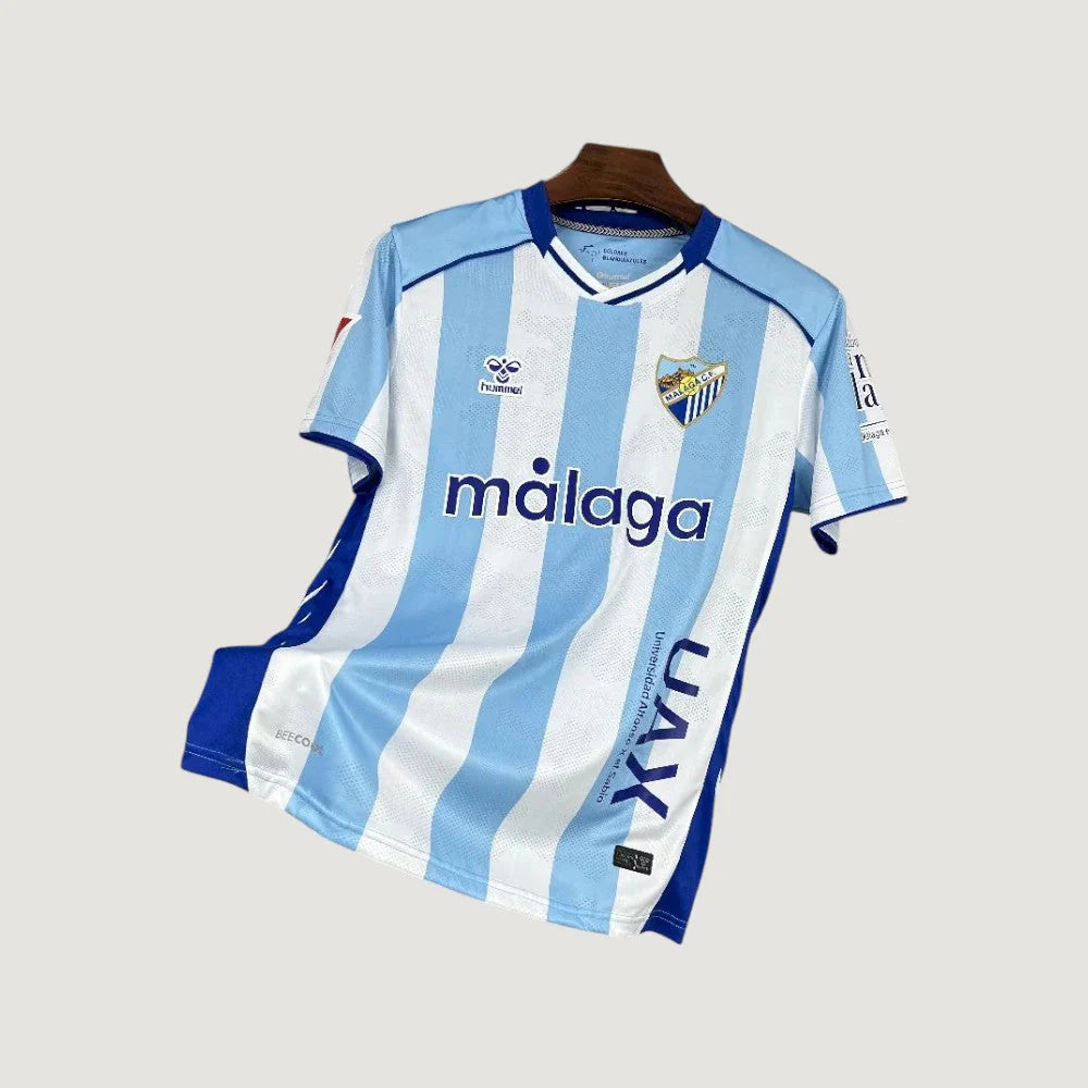 Málaga CF – Home Shirt 25/26 – Light Blue & White